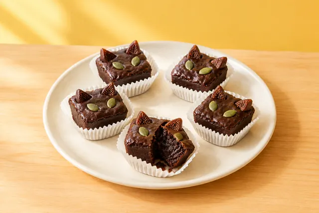 Brownie bites decorated like little black cats